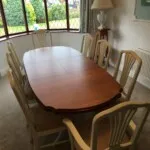 Wooden table with cream chairs